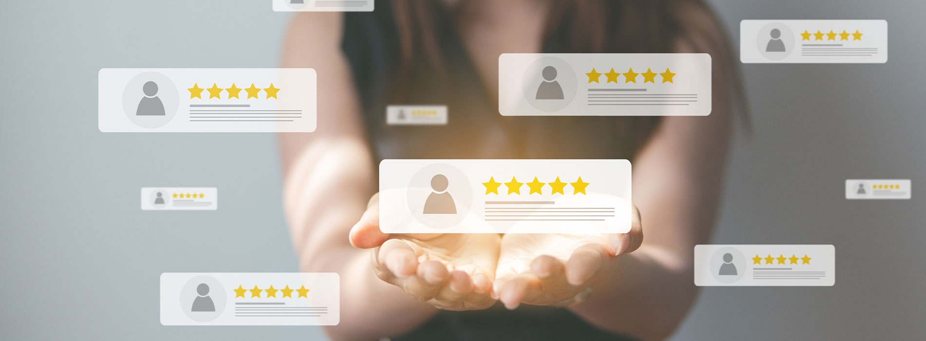 The image shows a hand holding a tablet with a star rating graphic on the screen, indicating high customer satisfaction or approval.